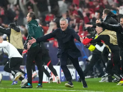 Benfica's head coach Jose Mourinho runs celebrating at the end of a Champions League opening phase soccer match between Benfica and Real Madrid, in Lisbon, Wednesday, Jan. 28, 2026. (AP Photo/Armando Franca)