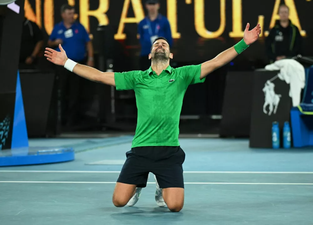Tennis - Australian Open - Melbourne Park, Melbourne, Australia - January 31, 2026 Serbia's Novak Djokovic celebrates winning his semi final match against Italy's Jannik Sinner REUTERS/Jaimi Joy