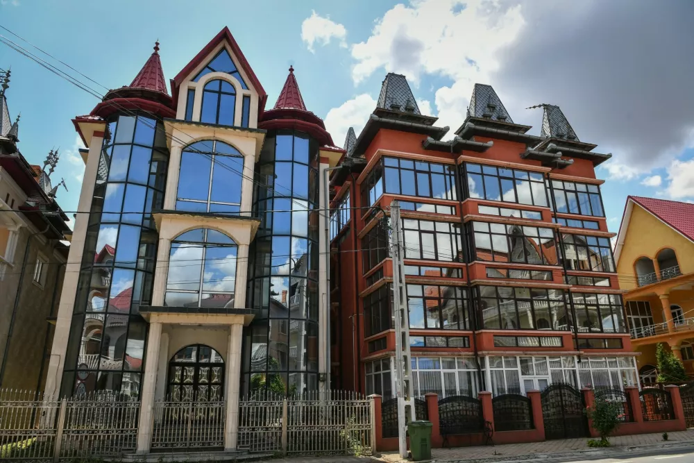 Palaces belonging to Romanian Roma people are pictured in Buzescu village, southern Romania, on July 11, 2019. In Romania's fields or on the outskirts of villages, the "Roma palaces" -- their imposing facades shining with ornaments -- stand in stark contrast to their modest surroundings, revealing their owners' quests for status within a marginalised minority.,Image: 461203983, License: Rights-managed, Restrictions: TO GO WITH AFP STORY by Ionut IORDACHESCU, Mihaela RODINA, Model Release: no