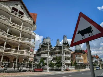 Palaces belonging to Romanian Roma people are pictured in Buzescu village, southern Romania, on July 11, 2019. In Romania's fields or on the outskirts of villages, the "Roma palaces" -- their imposing facades shining with ornaments -- stand in stark contrast to their modest surroundings, revealing their owners' quests for status within a marginalised minority.,Image: 461203988, License: Rights-managed, Restrictions: TO GO WITH AFP STORY by Ionut IORDACHESCU, Mihaela RODINA, Model Release: no
