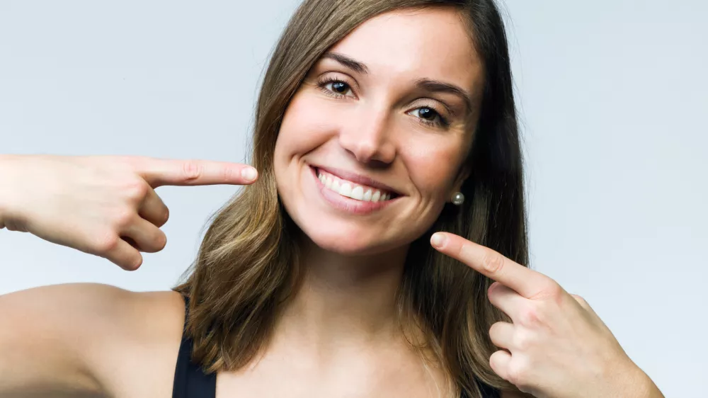 Sreča je naklonjena tistim, ki se smejijo, pravi stari japonski pregovor. Toda nasmeh je lahko tudi zavajajoč. / Foto: Istock