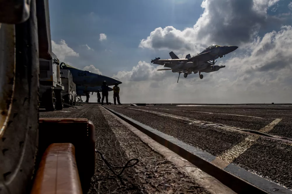 This handout image from the U.S. Navy shows an EA-18G Growler landing on the flight deck of the Nimitz-class aircraft carrier USS Abraham Lincoln in the Indian Ocean on Jan. 23, 2026. (Mass Communication Specialist Seaman Daniel Kimmelman/U.S. Navy via AP)