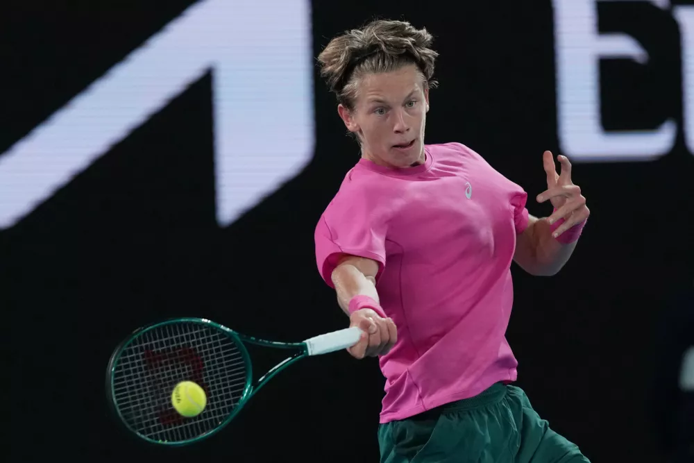 Ziga Sesko of Slovenia plays a forehand return to Keaton Hance of the U.S. during the boy's singles final at the Australian Open tennis championship in Melbourne, Australia, Sunday, Feb. 1, 2026. (AP Photo/Dar Yasin)