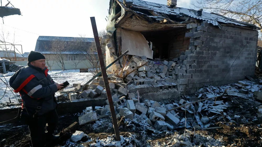Konstantin (no last name given) inspects his house, which was destroyed during what Russian-installed authorities called a recent Ukrainian drone attack, in the course of Russia-Ukraine conflict in the settlement of Sartana in the Donetsk region, a Russian-controlled area of Ukraine, February 1, 2026. REUTERS/Alexander Ermochenko