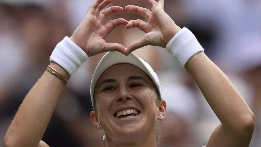 Switzerland's Belinda Bencic celebrates after beating Mirra Andreeva of Russia in a quarterfinal women's singles match between at the Wimbledon Tennis Championships in London, Wednesday, July 9, 2025. (AP Photo/Kin Cheung)