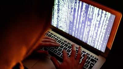 A hacker in action behind a computer. A hacker (sometimes also called a squatter or cracker) is a person who penetrates a computer network by evading security. There are hackers with criminal intentions (black hats); for many, however, it is a sport to crack secure networks and where possible to report ethically. Netherlands on March 14, 2022. Photo by Robin Utrecht/ABACAPRESS.COMNo Use Netherlands. No Use Germany.