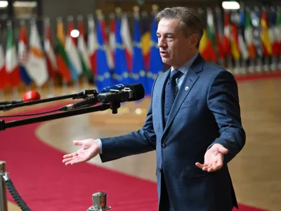Slovenia's Prime Minister Robert Golob speaks with the media as he arrives for the EU summit in Brussels, Thursday, Jan. 22, 2026. (AP Photo/Harry Nakos)