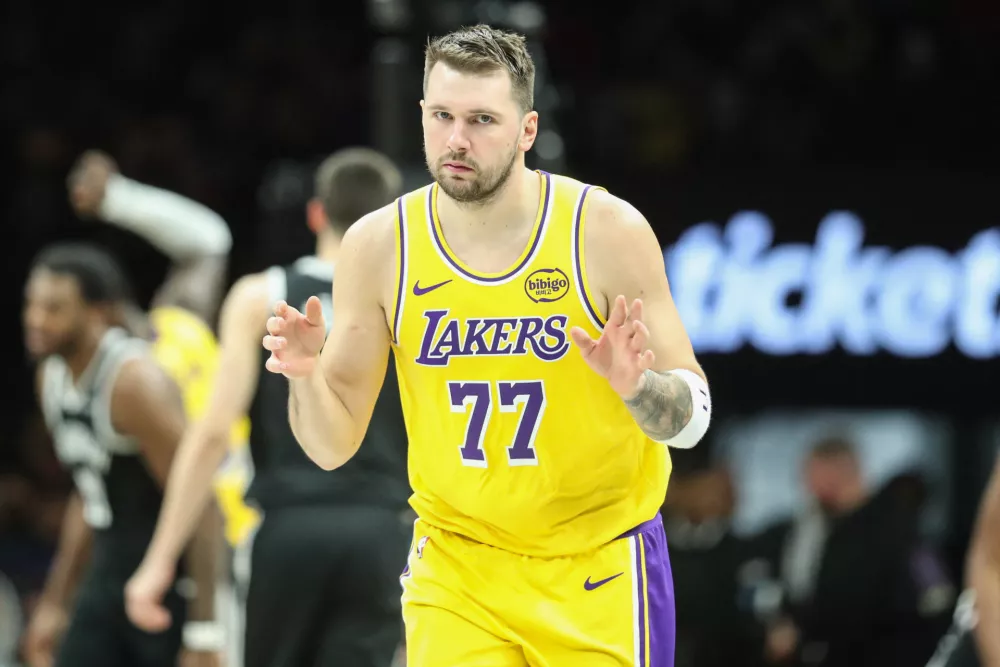 Feb 3, 2026; Brooklyn, New York, USA; Los Angeles Lakers guard Luka Doncic (77) gestures after scoring in the third quarter against the Brooklyn Nets at Barclays Center. Mandatory Credit: Wendell Cruz-Imagn Images