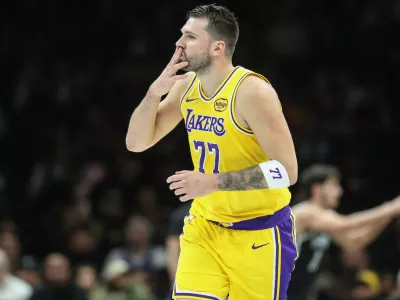 Feb 3, 2026; Brooklyn, New York, USA; Los Angeles Lakers guard Luka Doncic (77) gestures after scoring in the first quarter against the Brooklyn Nets at Barclays Center. Mandatory Credit: Wendell Cruz-Imagn Images