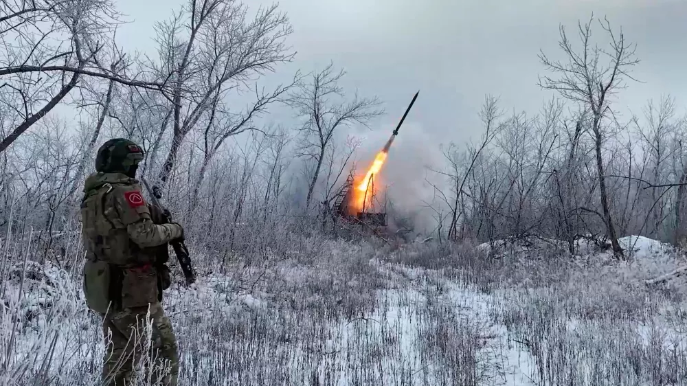 In this image made from video provided by Russian Defense Ministry Press Service on Wednesday, Feb. 4, 2026, Russian Multiple rocket launcher TOS-1A fires towards Ukrainian positions on an undisclosed location in Ukraine. (Russian Defense Ministry Press Service via AP)