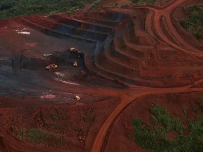 FILE PHOTO: Mining vehicles operate at the blocks three and four of the Simandou mine, one of the largest high-grade iron ore deposits, run by Rio Tinto and partners' joint venture, SimFer, in the Nzerekore Region, Guinea November 4, 2025. REUTERS/Luc Gnago/File Photo