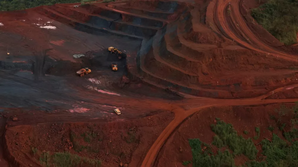 FILE PHOTO: Mining vehicles operate at the blocks three and four of the Simandou mine, one of the largest high-grade iron ore deposits, run by Rio Tinto and partners' joint venture, SimFer, in the Nzerekore Region, Guinea November 4, 2025. REUTERS/Luc Gnago/File Photo