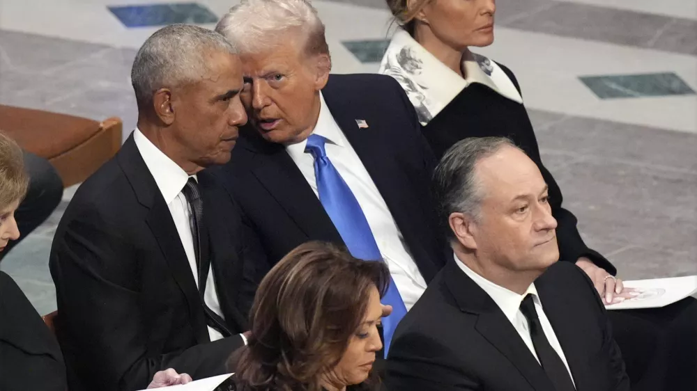 Former President Barack Obama talks with President-elect Donald Trump as Melania Trump listens and as Vice President Kamala Harris and second gentleman Doug Emhoff arrive, before the state funeral for former President Jimmy Carter at Washington National Cathedral in Washington, Thursday, Jan. 9, 2025. (AP Photo/Jacquelyn Martin)