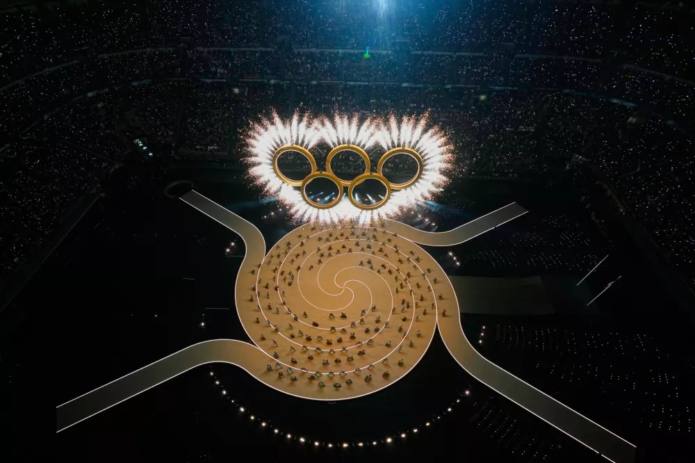 The Olympic rings are formed during the Olympic opening ceremony at the 2026 Winter Olympics, in Milan, Italy, Friday, Feb. 6, 2026. (AP Photo/David J. Phillip)