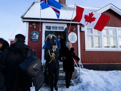 Canadian Governor General Mary Simon, right, leaves the newly opened Canadian consulate in Nuuk, Greenland, on Friday, Feb. 6, 2026. (Christinne Muschi/The Canadian Press via AP)
