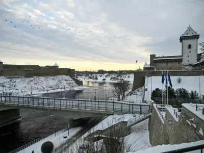 The Narva Castle (R) and the Ivangorod Fortress (L) are pictured and the border bridge across the Narva River in Narva, on January 15, 2026. Two medieval fortresses face each other across the Narva River separating Estonia from Russia on Europe's eastern edge. Once a symbol of cooperation, the "Friendship Bridge" connecting the two snow-covered banks has been reinforced with rows of razor wire and "dragon's teeth" anti-tank obstacles on the Estonian side.,Image: 1072434686, License: Rights-managed, Restrictions: TO GO WITH AFP STORY by Anna SMOLCHENKO, Model Release: no
