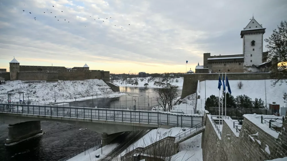 The Narva Castle (R) and the Ivangorod Fortress (L) are pictured and the border bridge across the Narva River in Narva, on January 15, 2026. Two medieval fortresses face each other across the Narva River separating Estonia from Russia on Europe's eastern edge. Once a symbol of cooperation, the "Friendship Bridge" connecting the two snow-covered banks has been reinforced with rows of razor wire and "dragon's teeth" anti-tank obstacles on the Estonian side.,Image: 1072434686, License: Rights-managed, Restrictions: TO GO WITH AFP STORY by Anna SMOLCHENKO, Model Release: no