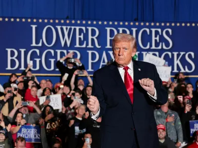 FILE PHOTO: U.S. President Donald Trump gestures as he arrives to deliver remarks on the U.S. economy and affordability at the Mount Airy Casino Resort in Mount Pocono, Pennsylvania, U.S. December 9, 2025. REUTERS/Jonathan Ernst/File Photo