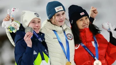 Milano Cortina 2026 Olympics - Ski Jumping - Women's Normal Hill Individual Victory Ceremony - Predazzo Ski Jumping Stadium, Predazzo, Italy - February 07, 2026. Gold medallist Anna Odine Stroem of Norway celebrates on the podium after winning the Women's Normal Hill Individual with silver medallist Nika Prevc of Slovenia and bronze medallist Nozomi Maruyama of Japan REUTERS/Stephanie Lecocq
