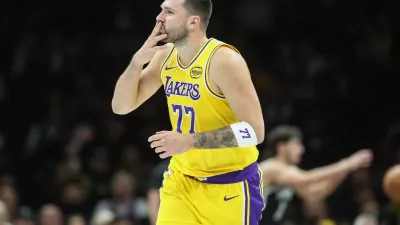 Feb 3, 2026; Brooklyn, New York, USA; Los Angeles Lakers guard Luka Doncic (77) gestures after scoring in the first quarter against the Brooklyn Nets at Barclays Center. Mandatory Credit: Wendell Cruz-Imagn Images