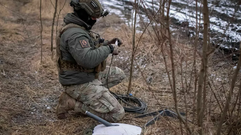 FILE PHOTO: A Ukrainian serviceman of 47th brigade prepares a Starlink satellite internet systems at his positions at a front line, amid Russia's attack on Ukraine, near the town of Avdiivka, recently captured by Russian troops in Donetsk region, Ukraine February 20, 2024. REUTERS/Inna Varenytsia/File Photo