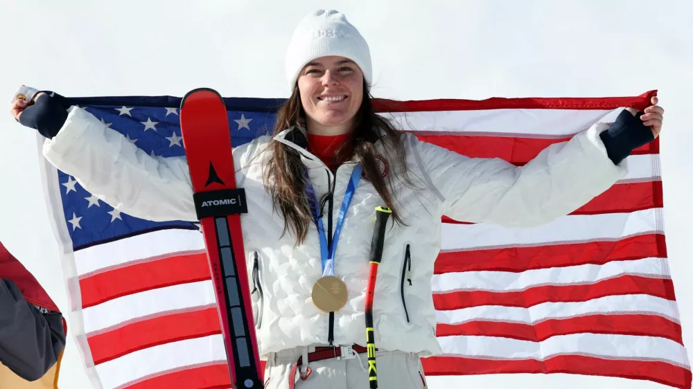 Milano Cortina 2026 Olympics - Alpine Skiing - Women's Downhill Victory Ceremony - Tofane Alpine Skiing Centre, Belluno, Italy - February 08, 2026. Gold medallist Breezy Johnson of United States celebrates after winning the women's downhill REUTERS/Leonhard Foeger