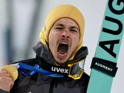 Milano Cortina 2026 Olympics - Ski Jumping - Men's Normal Hill Individual Victory Ceremony - Predazzo Ski Jumping Stadium, Predazzo, Italy - February 09, 2026. Gold medallist Philipp Raimund of Germany celebrates during the victory ceremony. REUTERS/Stephanie Lecocq   TPX IMAGES OF THE DAY