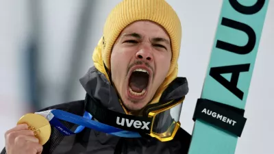 Milano Cortina 2026 Olympics - Ski Jumping - Men's Normal Hill Individual Victory Ceremony - Predazzo Ski Jumping Stadium, Predazzo, Italy - February 09, 2026. Gold medallist Philipp Raimund of Germany celebrates during the victory ceremony. REUTERS/Stephanie Lecocq   TPX IMAGES OF THE DAY