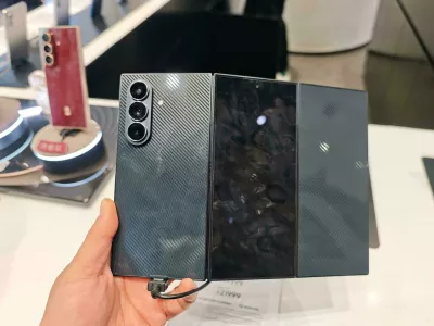 Customers experience the Galaxy Z TriFold smartphone at a flagship store in Shanghai, China, 25 December, 2025.No Use China. No Use France.