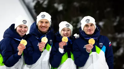 Italija, Predazzo.Zimske olimpijske igre 2026.Smucarski skoki, mesane ekipe.Olimpijski prvaki Nika Vodan, Anze Lanisek, Nika Prevc in Domen Prevc.