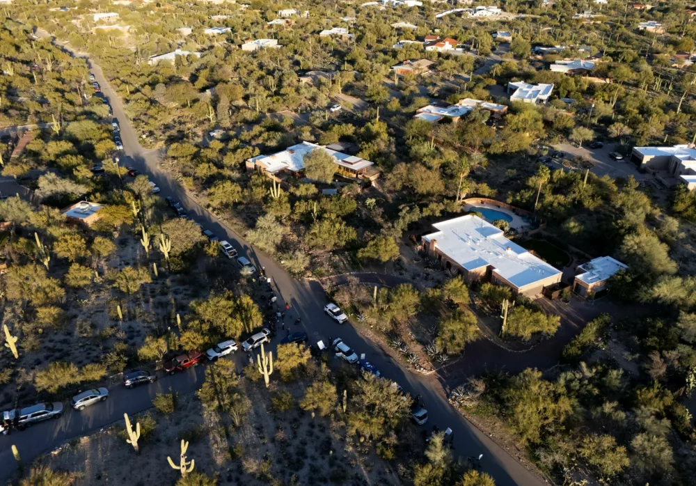 A drone view shows media staging near the home of Nancy Guthrie, the 84-year-old mother of U.S. journalist and television host Savannah Guthrie, who went missing from her home in Tucson, U.S. February 9, 2026. REUTERS/Rebecca Noble