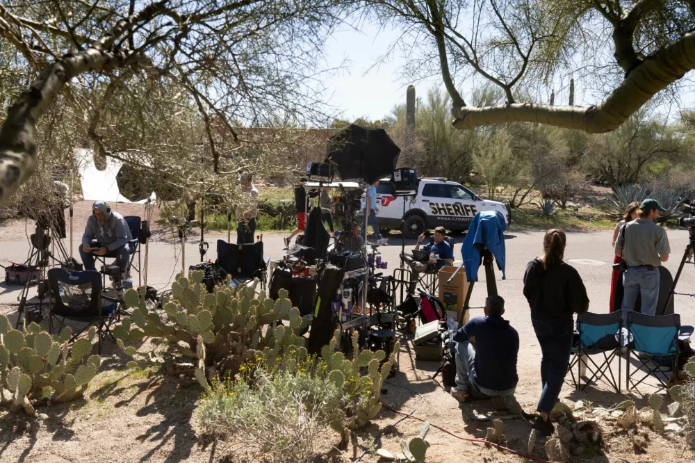 Members of the media report outside of the home of Nancy Guthrie, the 84-year-old mother of U.S. journalist and television host Savannah Guthrie, who went missing from her home in Tucson, U.S. February 9, 2026. REUTERS/Rebecca Noble