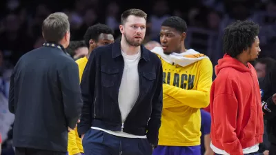 Los Angeles Lakers guard Luka Doncic stands on the court during timeout in an NBA basketball game against the Oklahoma City Thunder Monday, Feb. 9, 2026, in Los Angeles. (AP Photo/Jae C. Hong)