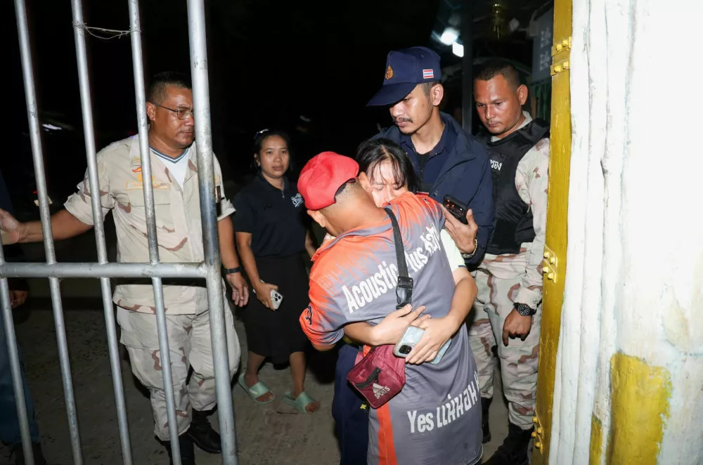 A girl reacts as she reunites with her family after being evacuated from Patongprathankiriwat School, where she had been hiding during an incident in which a gunman entered the school and held an unknown number of students and teachers hostage, in southern Thailand's Songkhla, Thailand, February 11, 2026. REUTERS/Roylee Suriyaworakul