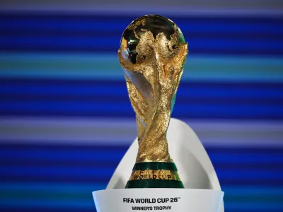FILED - 13 December 2024, Switzerland, Zuerich: The FIFA World Cup 2026 trophy is on display ahead of the draw ceremony for the 2026 World Cup Europe qualifiers. Photo: Christian Charisius/dpa