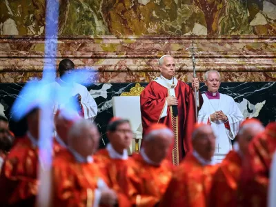 Pope Leo XIV arrives in St. Peter's Basilica at the Vatican for Mass for the repose of the soul of the late Pope Francis and deceased cardinals, Monday, Nov. 3, 2025. (AP Photo/Andrew Medichini)