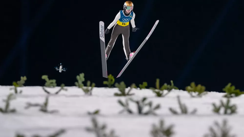 Nika Prevc, of Slovenia, soars through the air during the ski jumping mixed team competition at the 2026 Winter Olympics, in Predazzo, Italy, Tuesday, Feb. 10, 2026. (AP Photo/Kirsty Wigglesworth)