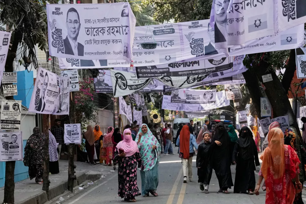 Bangladeshi women leave after casting their votes outside a polling station during national parliamentary election in Dhaka, Bangladesh, Thursday, Feb. 12, 2026. (AP Photo/Anupam Nath)