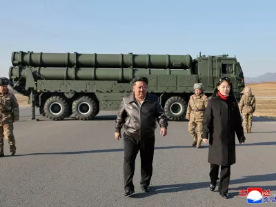 North Korean leader Kim Jong Un, accompanied by his daughter Kim Ju Ae, directs a test of a large-caliber multiple-rocket launch system, in an unknown location, North Korea, January 27, 2026, in this picture released by North Korea's official Korean Central News Agency on January 28, 2026.  KCNA via REUTERS  ATTENTION EDITORS - THIS IMAGE WAS PROVIDED BY A THIRD PARTY. REUTERS IS UNABLE TO INDEPENDENTLY VERIFY THIS IMAGE. NO THIRD PARTY SALES. SOUTH KOREA OUT. NO COMMERCIAL OR EDITORIAL SALES IN SOUTH KOREA.