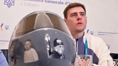 12 February 2026, Italy, Milan: Ukrainian skeleton racer Vladyslav Heraskevych speaks at a press conference at the Ukrainian Consulate in Milan, on the sidelines of the Milano Cortina 2026 Winter Olympic games. Heraskevych was disqualified from the competition because he insisted on wearing a helmet with photos of Ukrainian athletes who were killed in Russia's war of aggression. Photo: Peter Kneffel/dpa