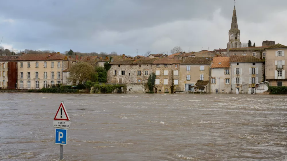 View of the Vienne river in Confolens as severe flooding hits western France amid storm Nils, Thursday, Feb. 12, 2026. (AP Photo/Yohan Bonnet)