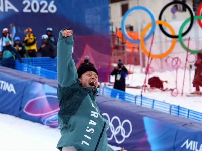 Milano Cortina 2026 Olympics - Alpine Skiing - Men's Giant Slalom Victory Ceremony - Stelvio Ski Centre, Bormio, Italy - February 14, 2026. Gold medallist Lucas Pinheiro Braathen of Brazil celebrates on the podium during the men's giant slalom victory ceremony REUTERS/Denis Balibouse