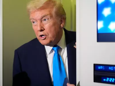 FILE - President Donald Trump speaks with reporters&nbsp;aboard Air Force One at Al Udeid Air Base in Doha, Qatar, Oct. 25, 2025. (AP Photo/Mark Schiefelbein, File)