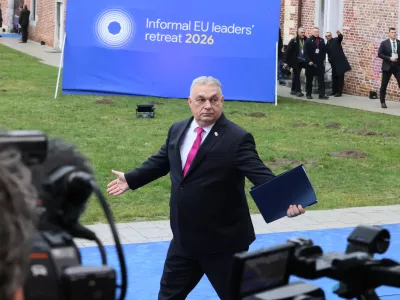Hungary's Prime Minister Viktor Orban, center, arrives for the EU summit at Alden Biesen Castle in Bilzen-Hoeselt, Belgium, Thursday, Feb. 12, 2026. (AP Photo/Francois Walschaerts)