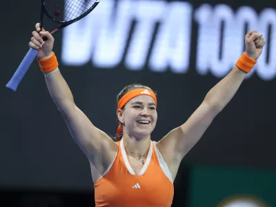 Czech Republic's Karolina Muchova reacts winning the Qatar Open tennis fina against Canada's Victoria Mboko in Doha, Qatar, on Saturday, Feb. 14, 2026. (AP Photo/Hussein Sayed)