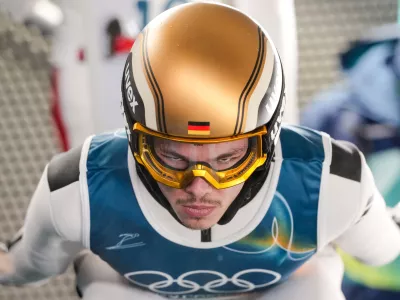 Philipp Raimund, of Germany, rehearses a jump during the ski jumping men's large hill individual at the 2026 Winter Olympics, in Predazzo, Italy, Saturday, Feb. 14, 2026. (AP Photo/Evgeniy Maloletka)