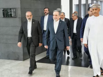 FILE - In this photo released by the Iranian Foreign Ministry, Iranian Foreign Minister Abbas Araghchi, center, heads to the venue for talks between Iran and the U.S., in Muscat, Oman, Friday, Feb. 6, 2026. (Iranian Foreign Ministry via AP, File)