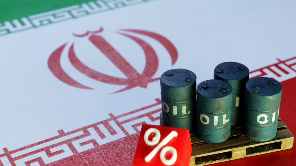 FILE PHOTO: Iranian flag and 3D printed oil barrels miniature are seen in this illustration taken June 23, 2025. REUTERS/Dado Ruvic/Illustration/File Photo