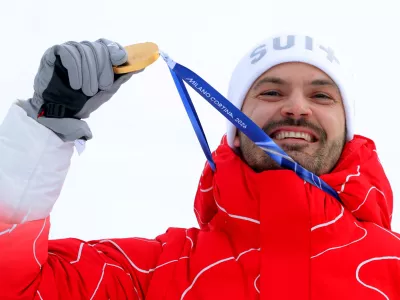 Milano Cortina 2026 Olympics - Alpine Skiing - Men's Slalom Victory Ceremony - Stelvio Ski Centre, Bormio, Italy - February 16, 2026. Gold medallist Loic Meillard of Switzerland celebrates on the podium during the men's slalom victory ceremony REUTERS/Denis Balibouse