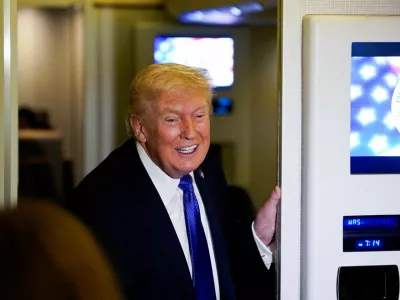 U.S. President Donald Trump reacts as he speaks to reporters onboard Air Force One, on travel from West Palm Beach, Florida, to Joint Base Andrews, Maryland, U.S., February 16, 2026. REUTERS/Elizabeth Frantz